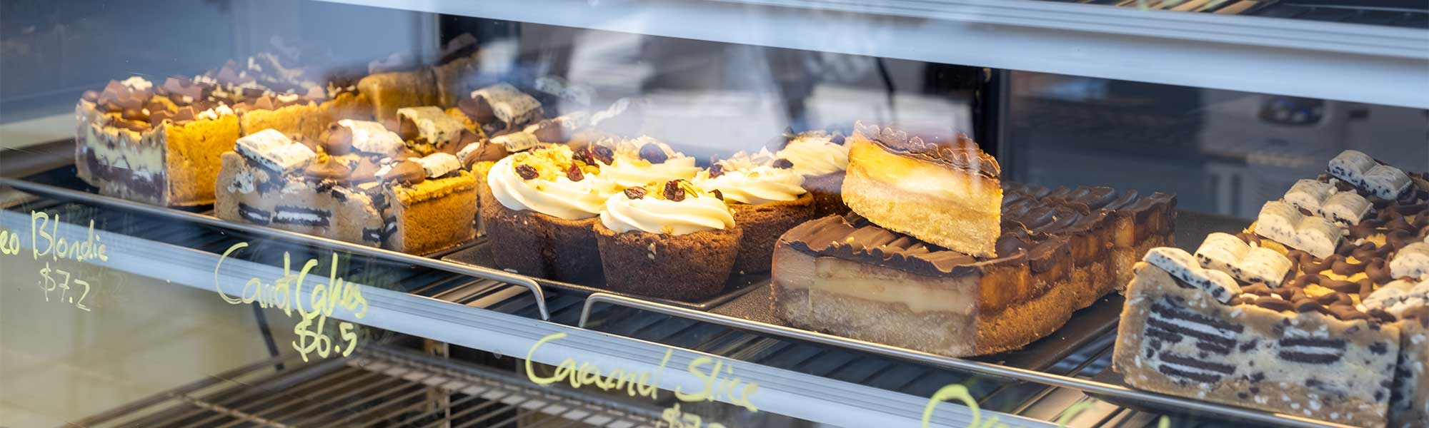 A range of cheesecakes in a cabinet at Mrs Kwakas