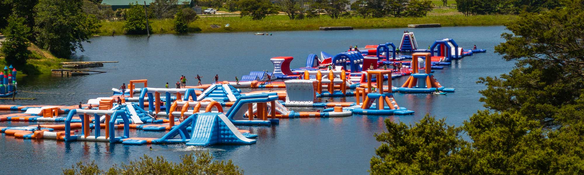 Kids enjoying the Adrenaline Adventure Park inflatable course