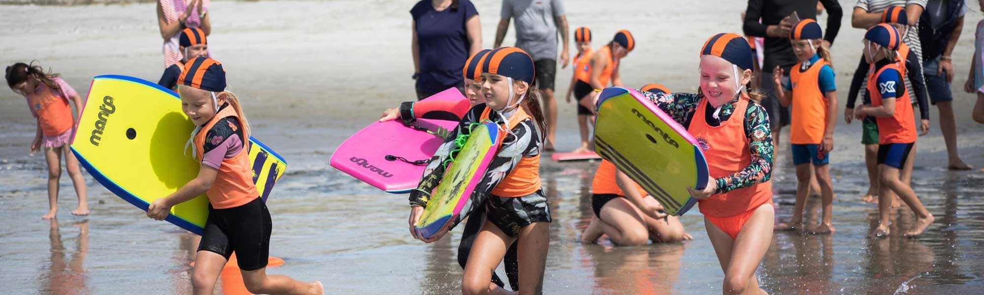 Children in the surf for the Little Nippers class at Ruakaka Beach