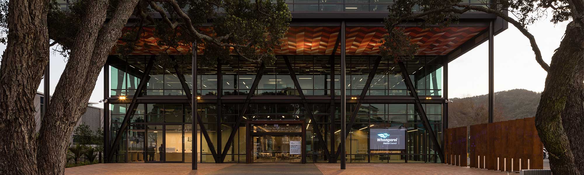 The entrance of the Council offices shown at dusk